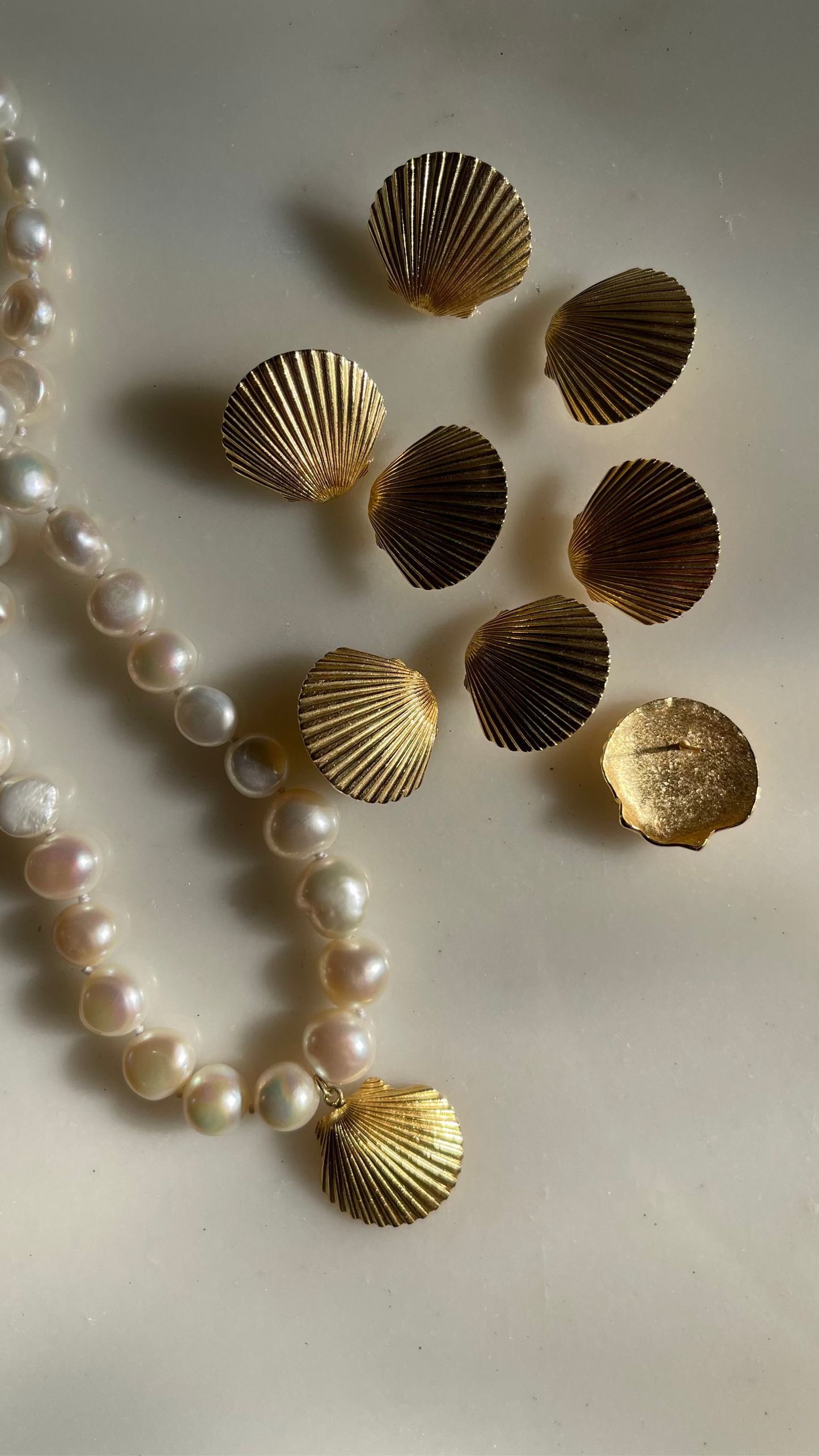 modern pearl necklace with shell pendant, shell earrings, jewellery made from gold plated silver and natural pearls