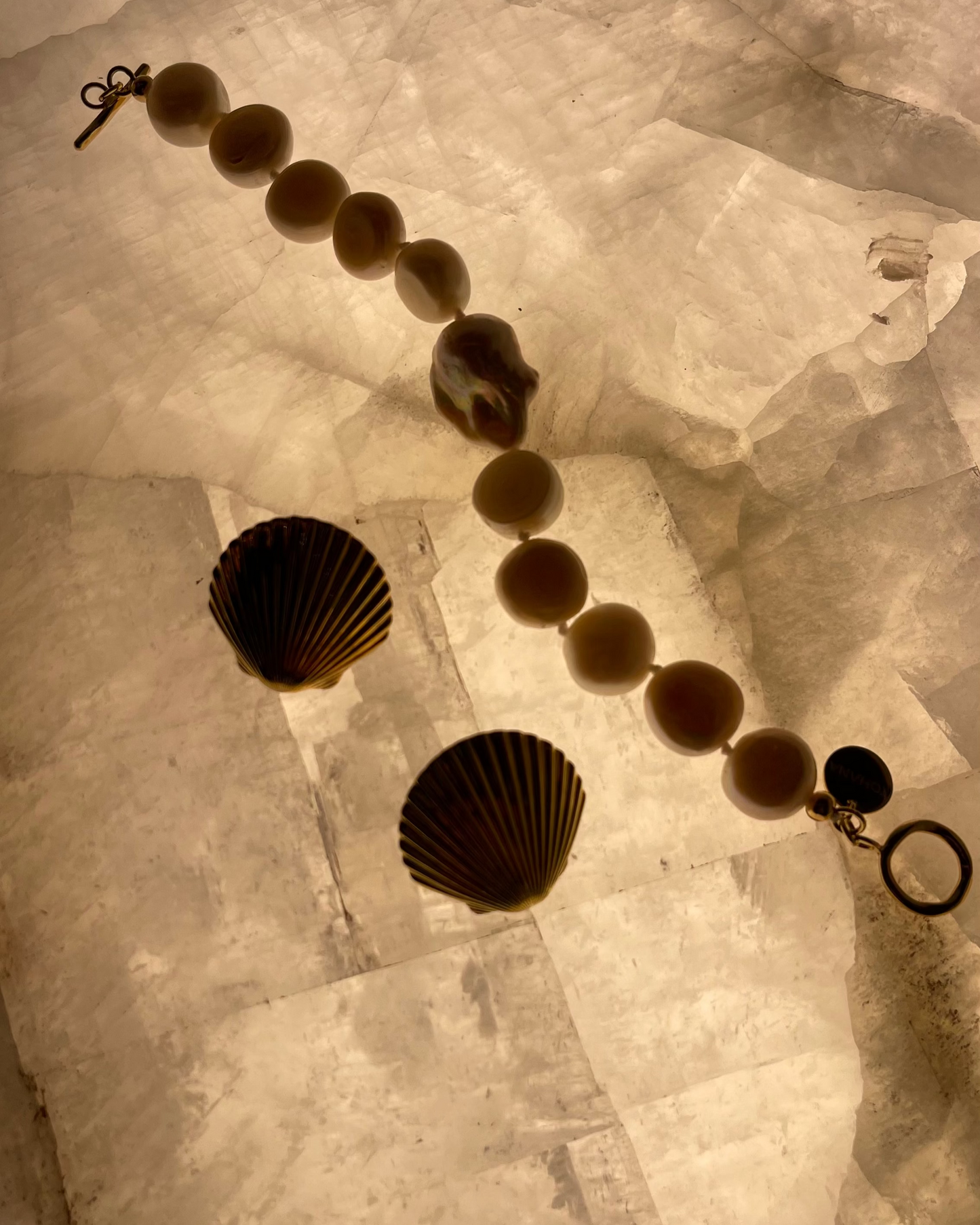 shell earrings and pearls bracelet with baroque pearl, fine jewellery, show fashion brand