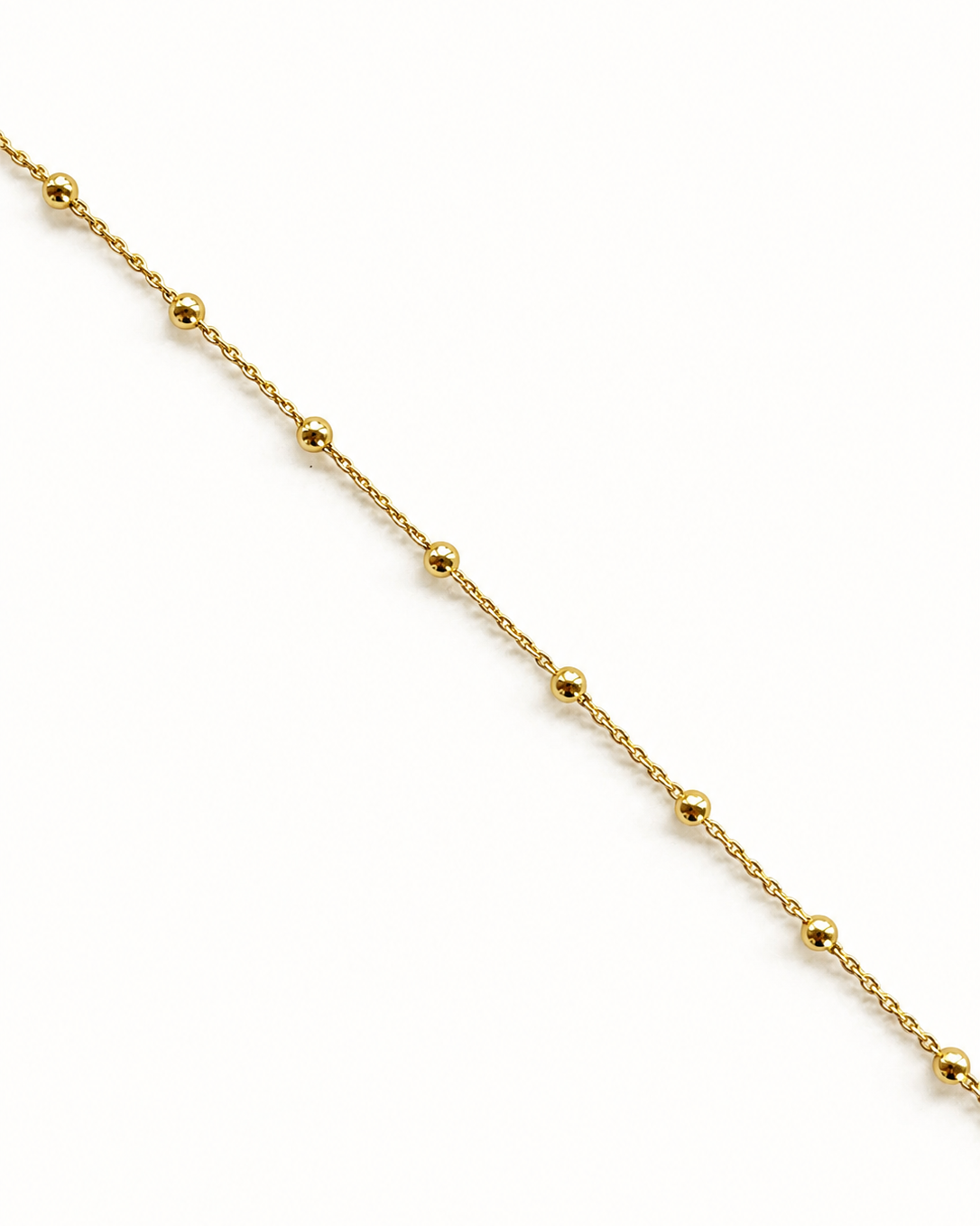 A delicate gold beaded chain